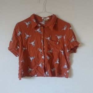 Orange button down crop top with cow skull pattern